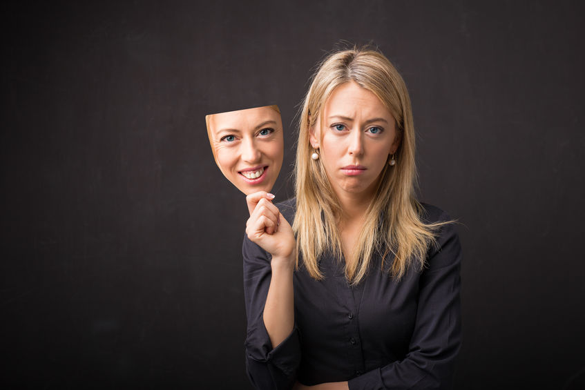 woman holding mask